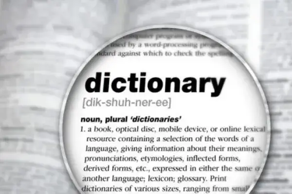 A magnifying glass over a dictionary page